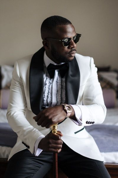 Groom in white tuxedo
