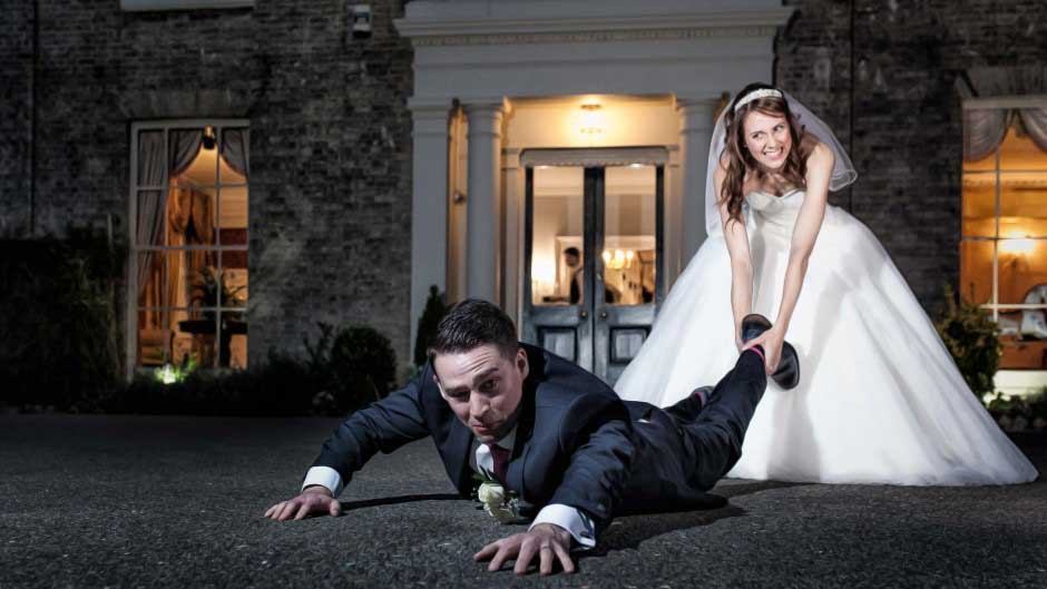Fennes Wedding Videographer - Quirky fun photo of bride pulling the groom by the foot