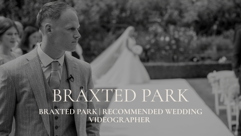 Braxted Park Recommended Wedding Videographer - A black and white photograph of a groom turning his head to see his bride walking down the aisle during an outdoor ceremony at Braxted Park.