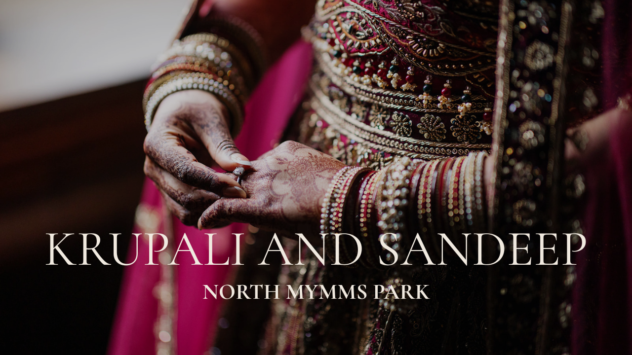 Close-up wedding photography of a bride’s intricate Mehndi and gold jewellery at North Mymms Park; featuring high-end documentary styling.