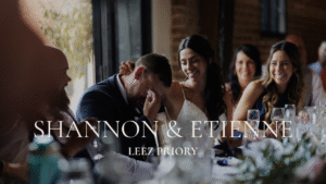 professional Essex wedding photography; a bride consoling a crying groom at the wedding breakfast table in Leez Priory, showcasing reportage style and authentic emotion.