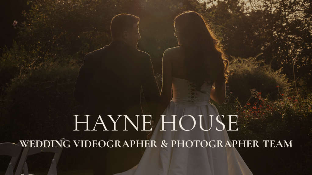 High-contrast documentary wedding film still at Hayne House; luxury Kent wedding photography featuring a couple walking towards the sunset.