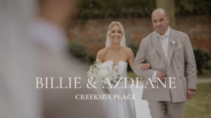 Creeksea Place wedding photography and videography; professional Essex wedding photographer capturing an outdoor garden ceremony; bride and father walking toward the groom at Creeksea Place.