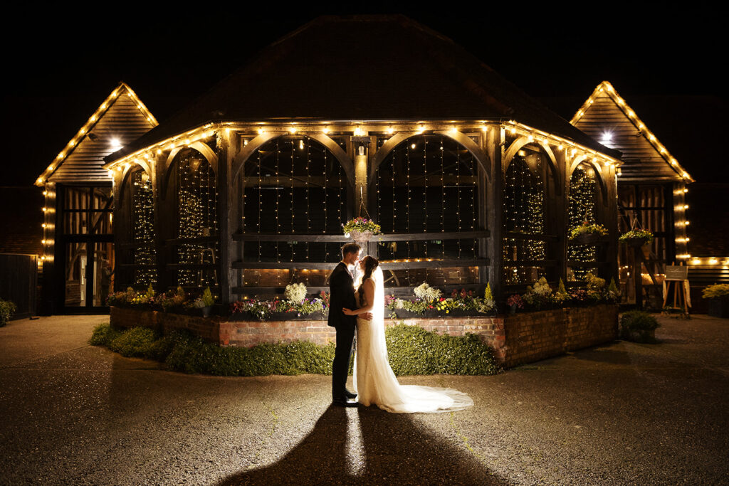 Lillibrooke Manor -backlit bride and groom night portrait