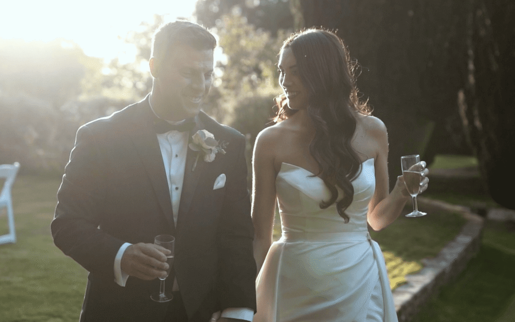 Fennes wedding photographer; Fennes wedding photography and videography; editorial bride and groom portrait walking in the golden hour sun at Fennes Estate.